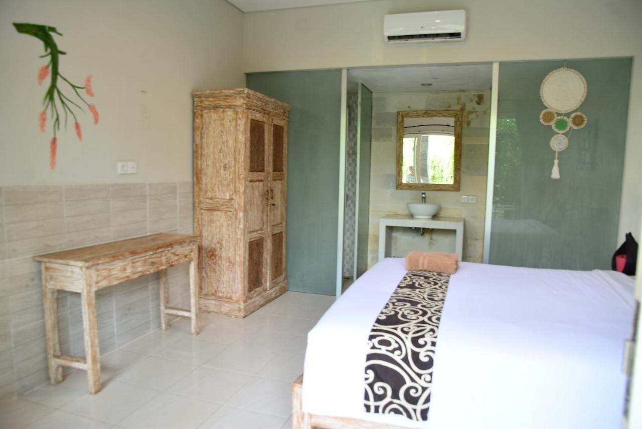 Asung Guesthouse Canggu Екстериор снимка